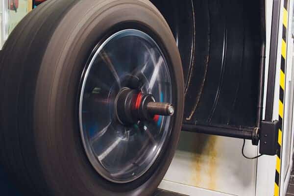 wheel balancing | Waupaca, WI | Little Wolf Automotive, image of tire spinning on wheel balancer