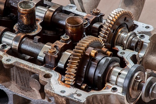 What are Cam Phasers? | Little Wolf Automotive in Waupaca, WI. Image of a camshaft on a car engine.