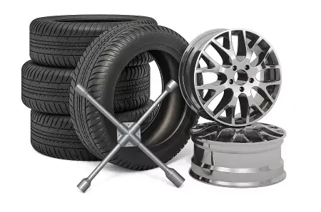 Image of new tires, wheels, and a cross wrench. Concept image of Little Wolf Auto offerring new tires and other tire services.