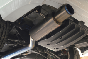 exhaust system repair, auto repair in Little Wolf Automotive at Waupaca, WI. Close-up view of a car's exhaust system.