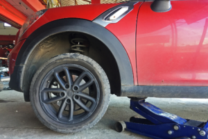 Mud Season Tire Rotation In Rothschild, WI At Eagle Express Lube. Image of Vehicle tire covered in mud, ready for tire rotation