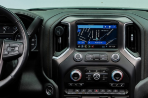 Auto A/C Repair in Wausau WI at Little Wolf Automotive. A modern GMC truck dashboard featuring digital climate control knobs set to 72 degrees, highlighting systems inspected during expert R-1234yf A/C service
