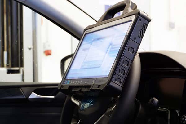Engine diagnostics Waupaca, WI | Little Wolf Automotive, image of digital scanner connected to steering wheel