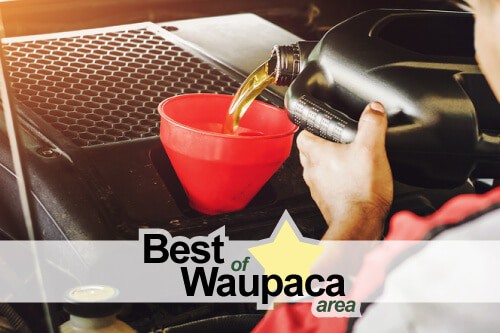Little Wolf Auto: Best of Waupaca in 2020 for Superb Auto Repair and Oil Changes , Little Wolf Automotive Waupaca Wi.;image of mechanic pouring oil in red funnel in a car engine with the "Best of Waupaca 2020" logo