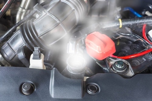 closeup of engine overheating due to cooling system issue Little Wolf Automotive in Waupaca Wi