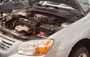 Image under an open hood of a car. Concept image of preventative maintenance.