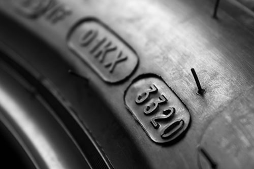 Dot code and date of production of the tire on the sidewall of the wheel. Concept image of “How Old is Too Old for Tires?” | Little Wolf in Plover, WI.
