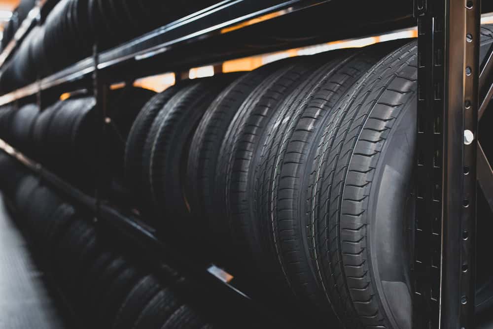 Tire service in Antigo, WI at Little Wolf Express Lube. Image of a new tire placed on the tire storage rack in the car service center. Be prepared for vehicles that need to change tires.