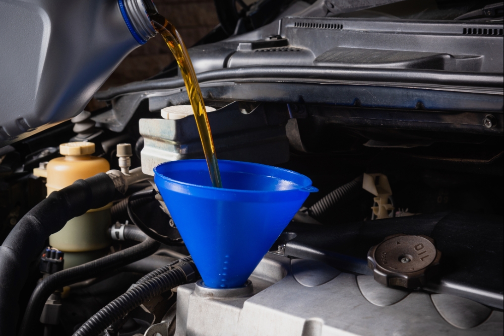 Oil Change for Healthy Engine, Oil Change in Rothschild, WI At Eagle Express Lube. Close-up of an oil change service on a vehicle engine