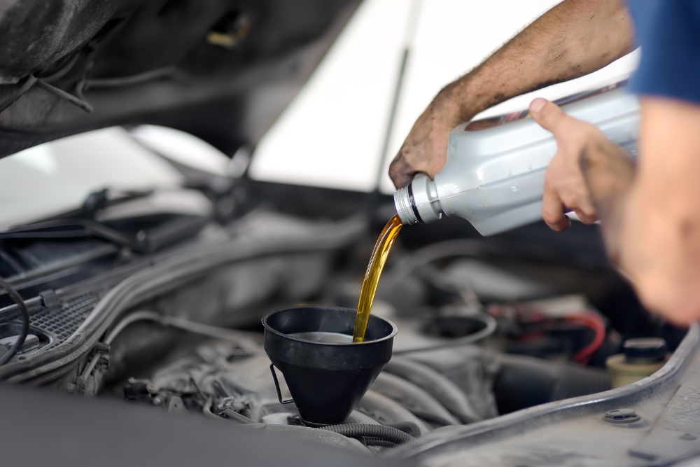 Express Oil Change in Antigo WI At Little Wolf. Car receiving professional express oil change in winter