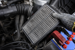 Cabin Air Filter Replacement in Rothschild WI At Eagle Express Lube. Close-up view of a dirty cabin air filter during vehicle maintenance